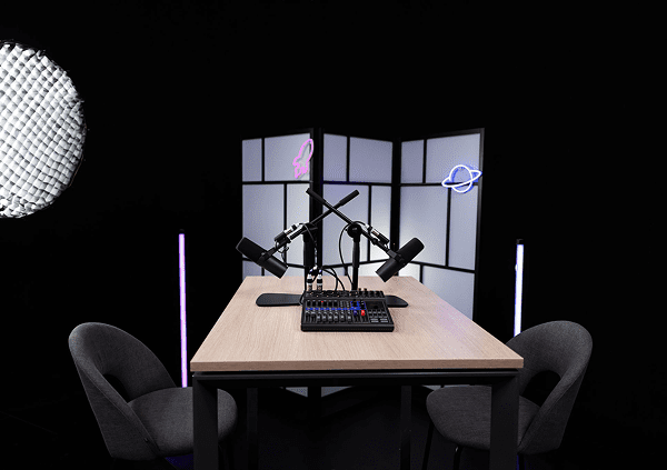 Empty podcast table and chairs setup