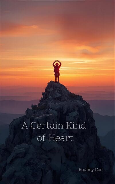 Person stands atop a mountain at sunset, forming a heart shape with hands.