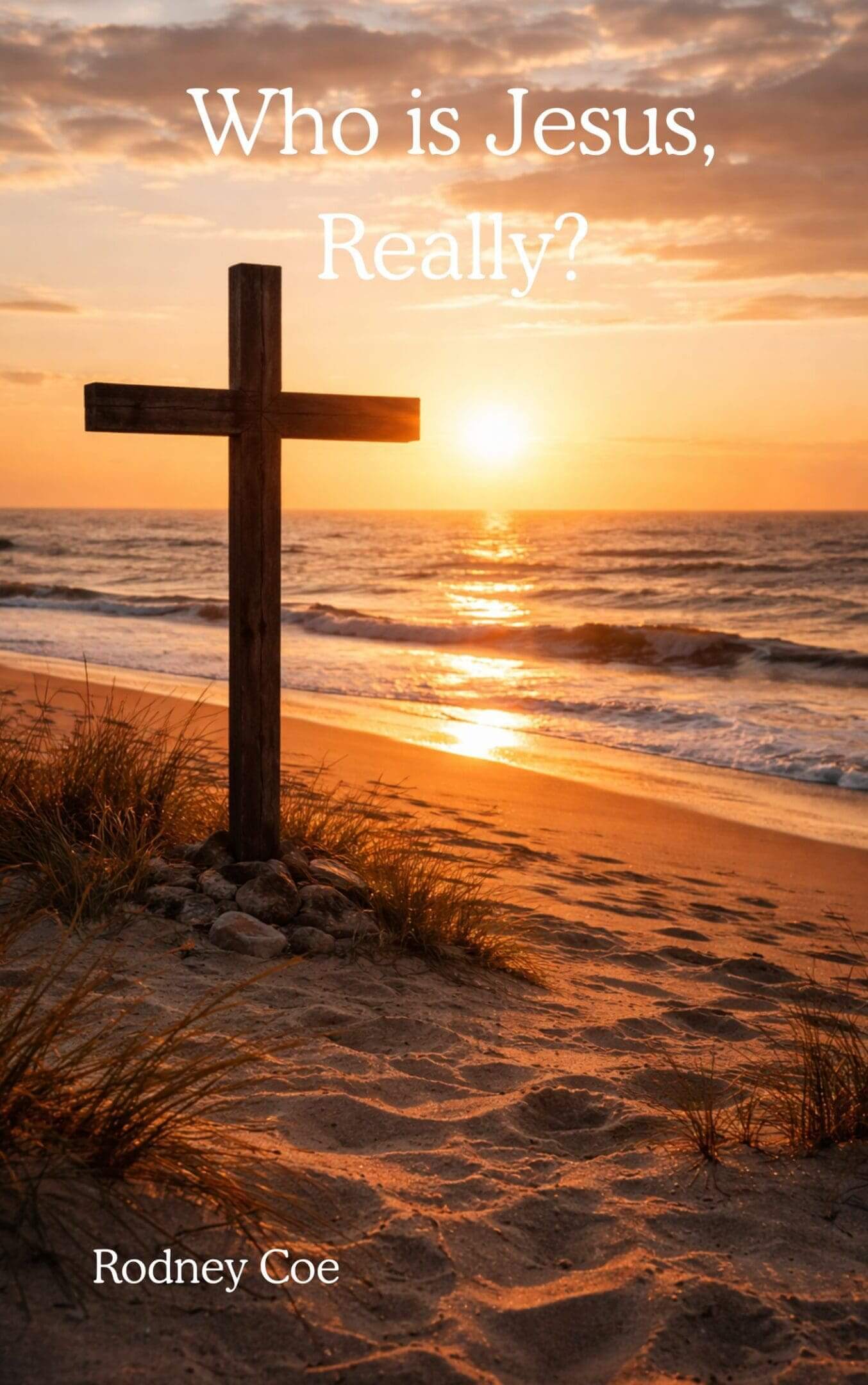 Wooden cross on a beach at sunset with waves and sand.