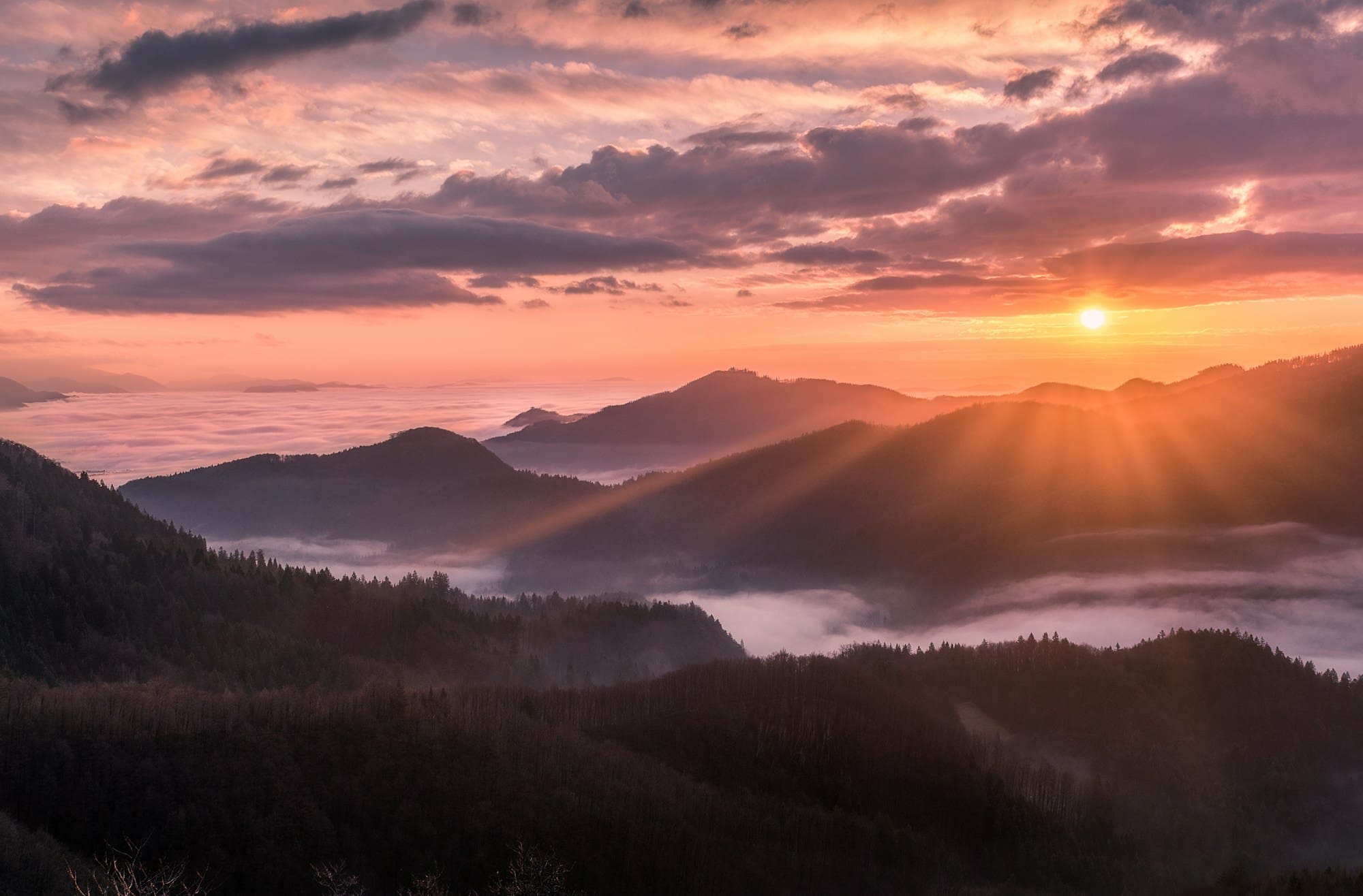 Sun rising over a sweeping mountain ridge — Where Heaven Came Down