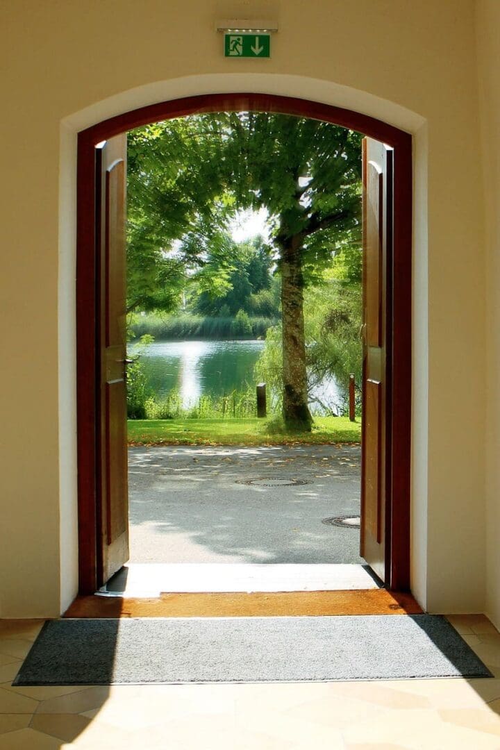 A narrow doorway with warm light streaming through, is Jesus the only way