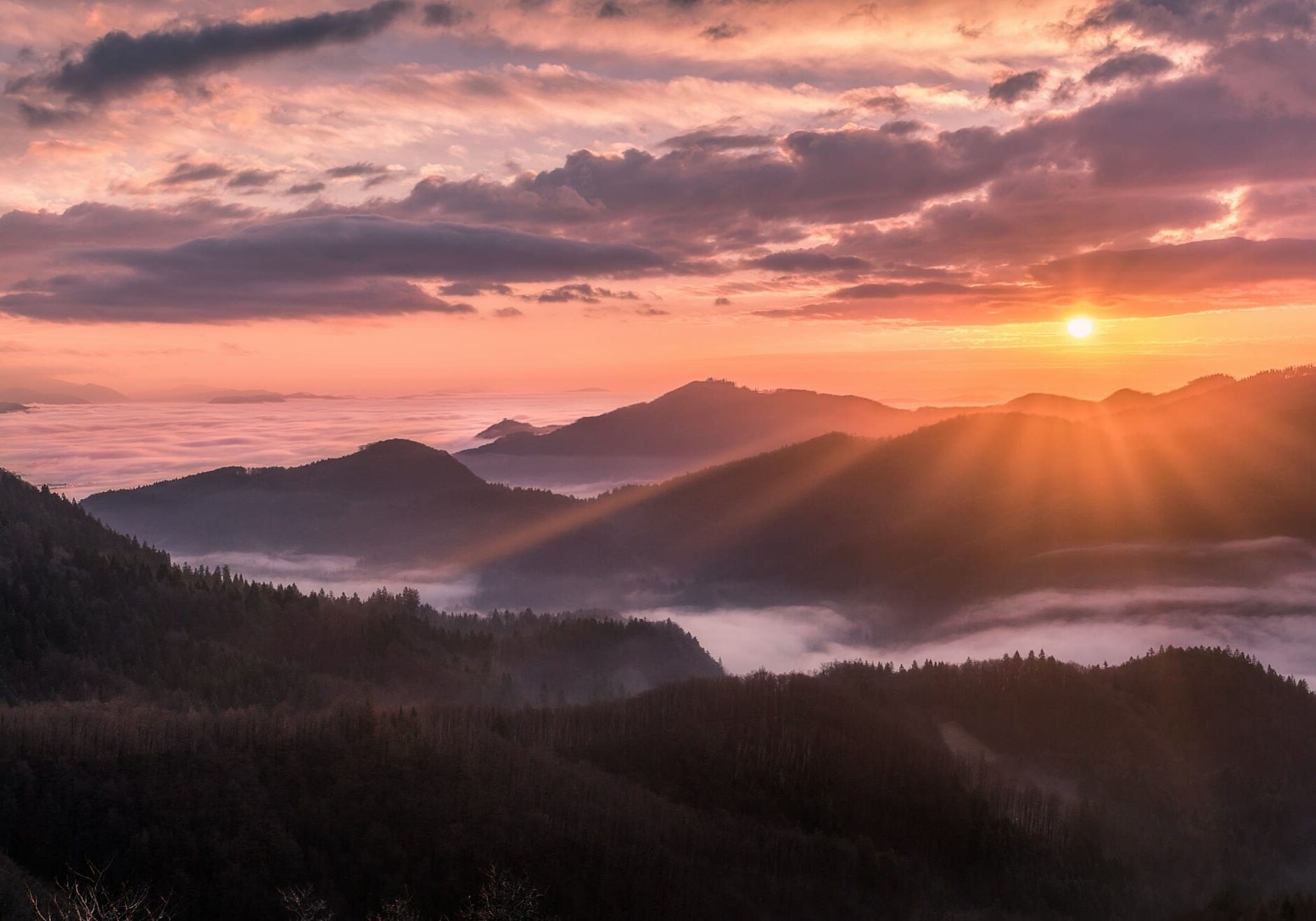 Sun rising over a sweeping mountain ridge — Where Heaven Came Down