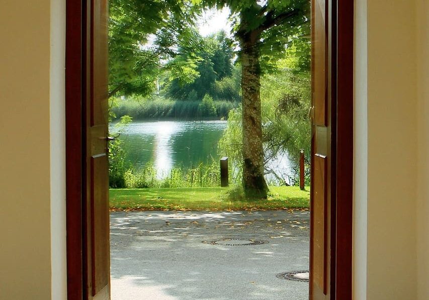 A narrow doorway with warm light streaming through, is Jesus the only way